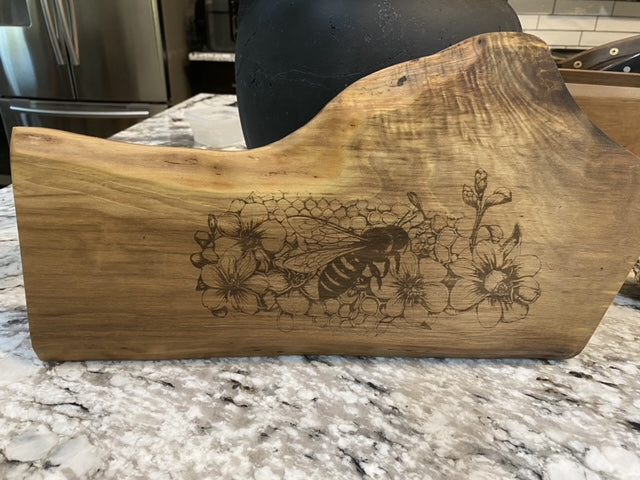 Custom Charcuterie Board featuring a Laser-Engraved Bee scene on Walnut.