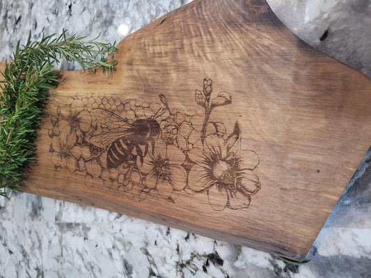 Custom Charcuterie Board featuring a Laser-Engraved Bee scene on Walnut.