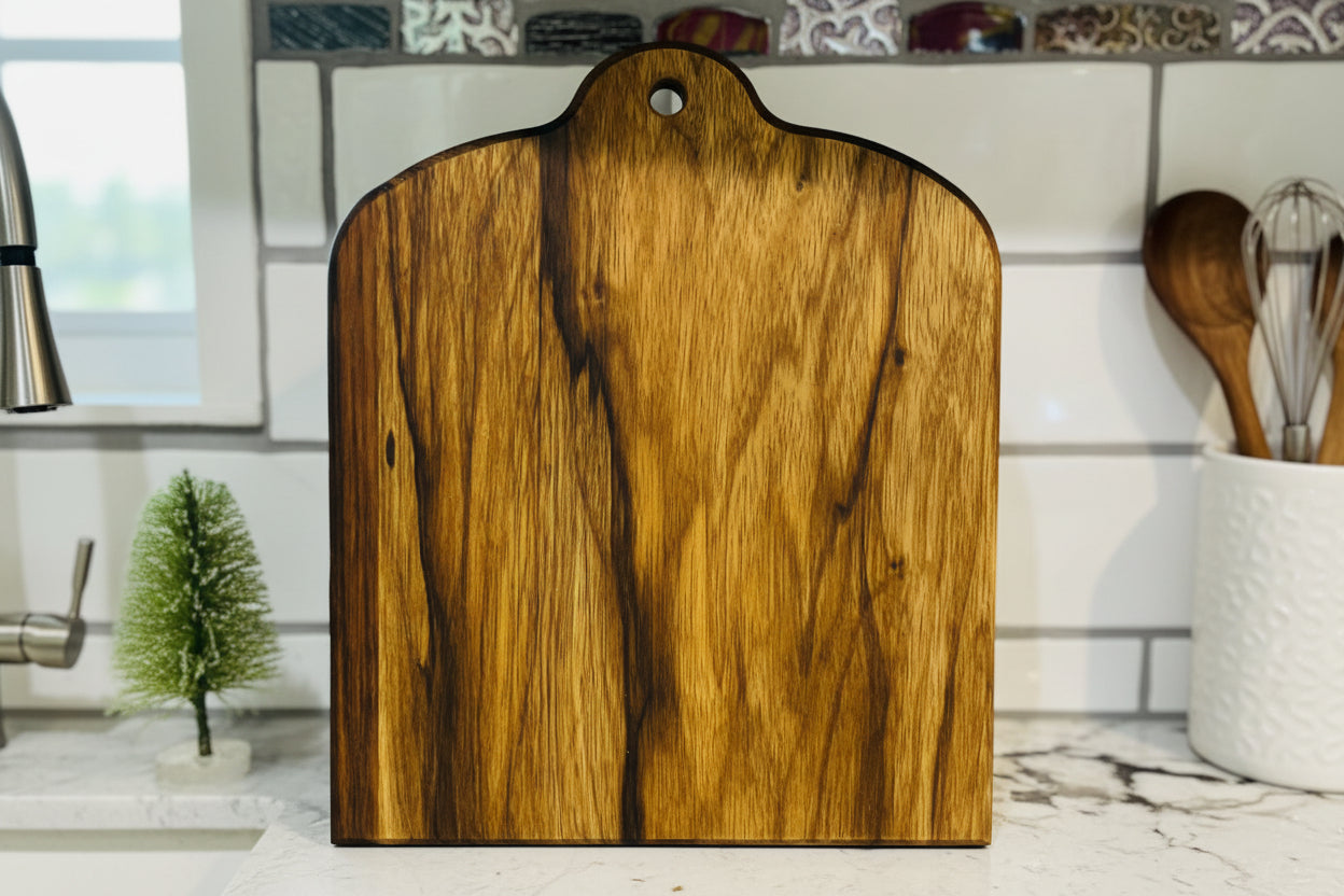 Black Limba cutting board staged in a kitchen 