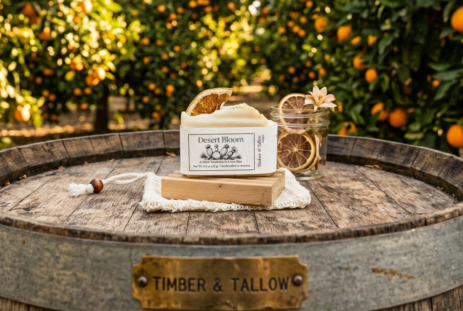 Desert Bloom Orange Soap sitting on a wine barrel