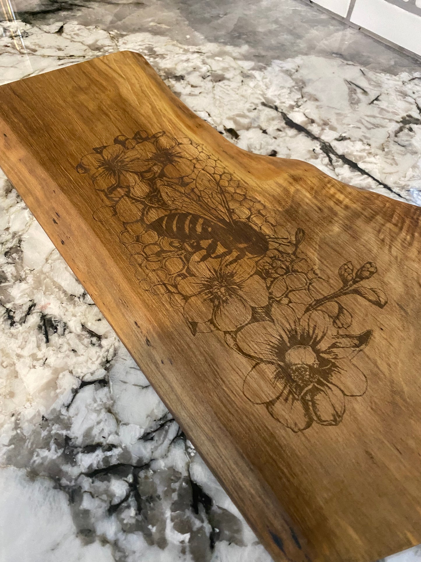 Custom Charcuterie Board featuring a Laser-Engraved Bee scene on Walnut.