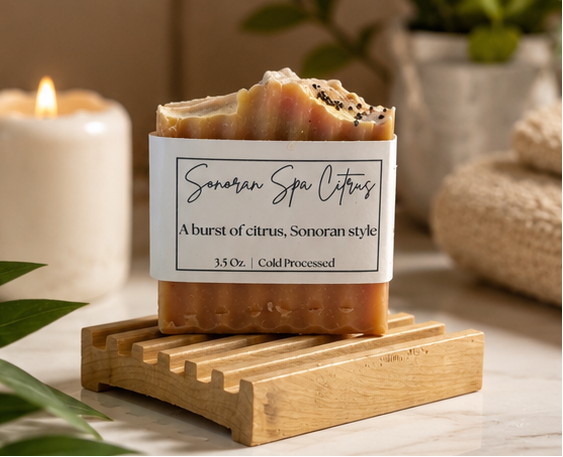 Bar of soap on a wooden stand with a label reading 'Sonoran Spa Citrus' in a home setting.