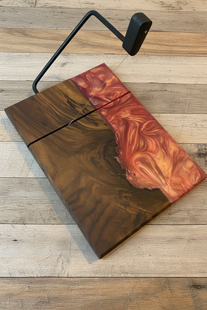 Walnut cutting board with pink resin on a wood slat background